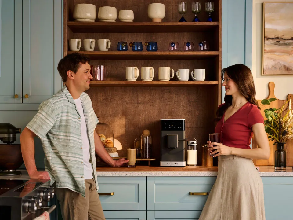 photo-left-right espresso-fully-auto-kf4 couple-enjoying-coffee-made-with-kf4-in-their-small-kitchen